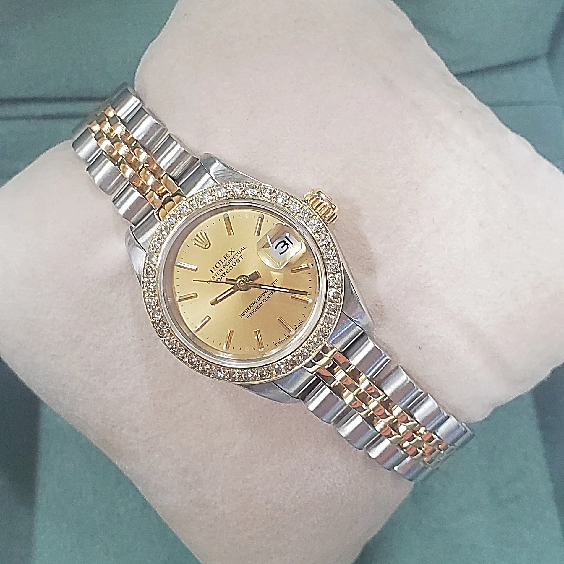 Ladies Rolex 26mm DateJust Two Tone 18K Gold Watch with Champagne Dial and Custom Diamond Bezel. (Pre-Owned)