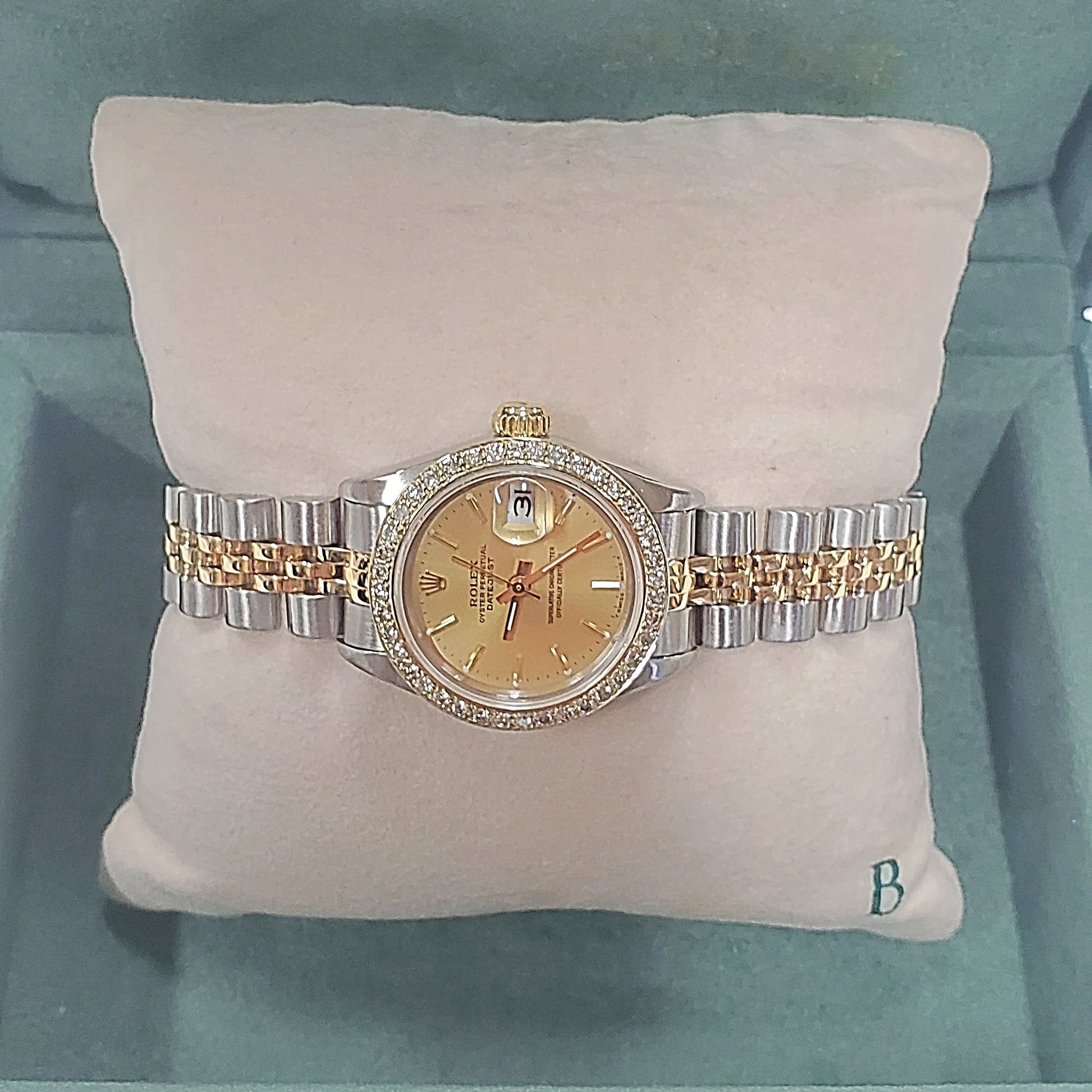 Ladies Rolex 26mm DateJust Two Tone 18K Gold Watch with Champagne Dial and Custom Diamond Bezel. (Pre-Owned)