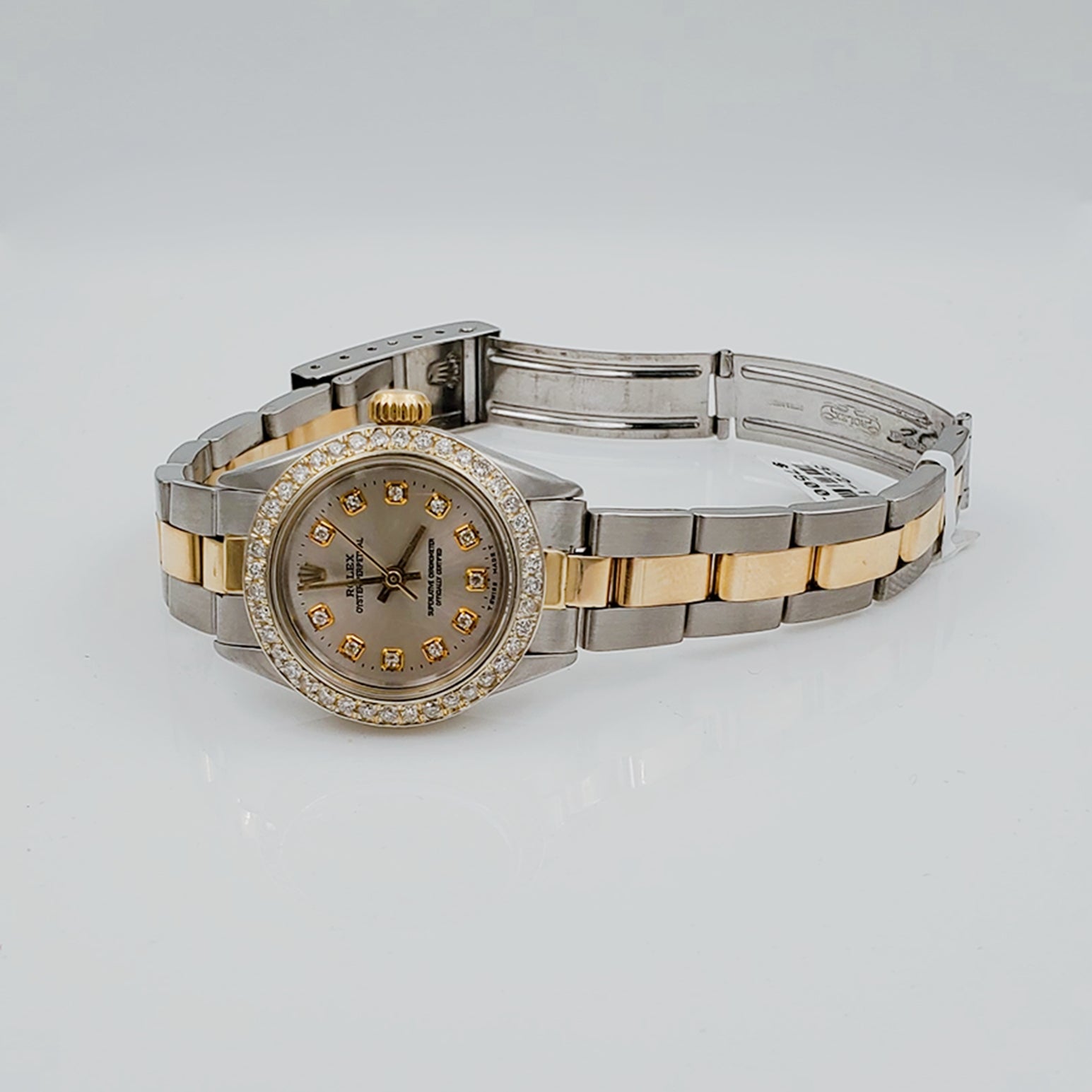 Ladies Rolex 26mm DateJust 18K Two Tone Watch with Silver Diamond Dial and Custom Diamond Bezel. (Pre-Owned)