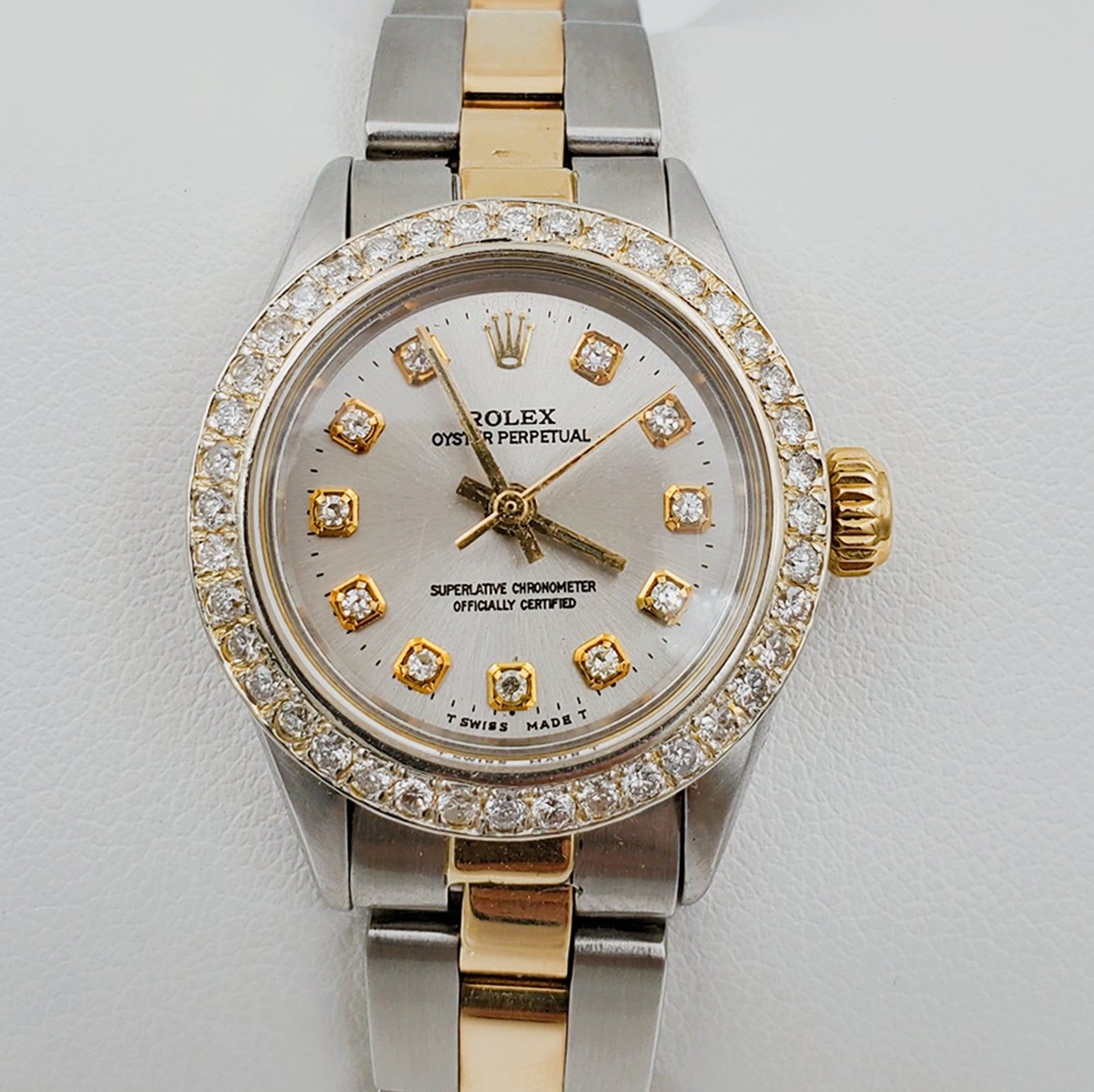 Ladies Rolex 26mm DateJust 18K Two Tone Watch with Silver Diamond Dial and Custom Diamond Bezel. (Pre-Owned)