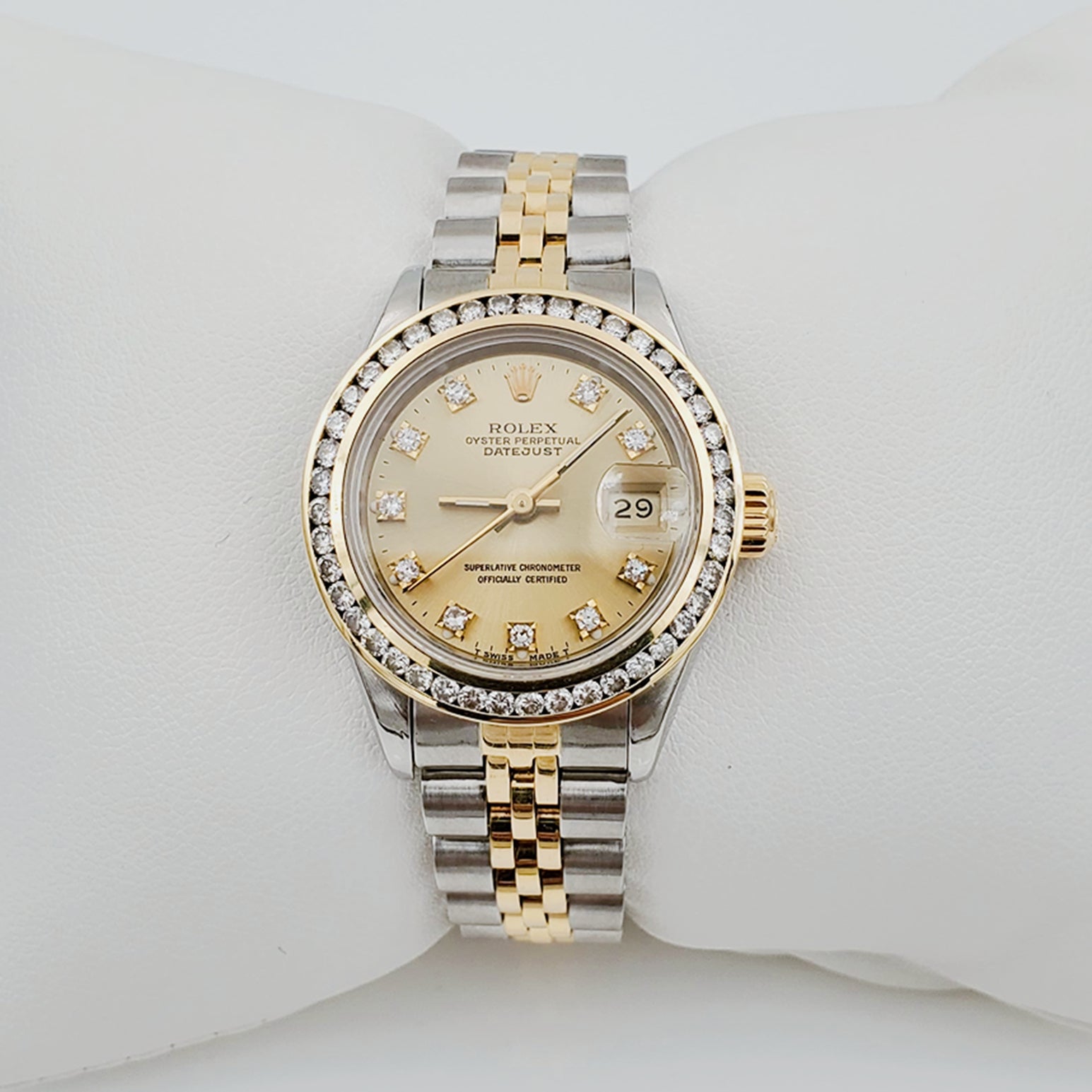 Ladies Rolex 26mm DateJust 18K Gold / Two Tone Stainless Steel Watch with Champagne Diamond Dial and Diamond Bezel. (Pre-Owned)