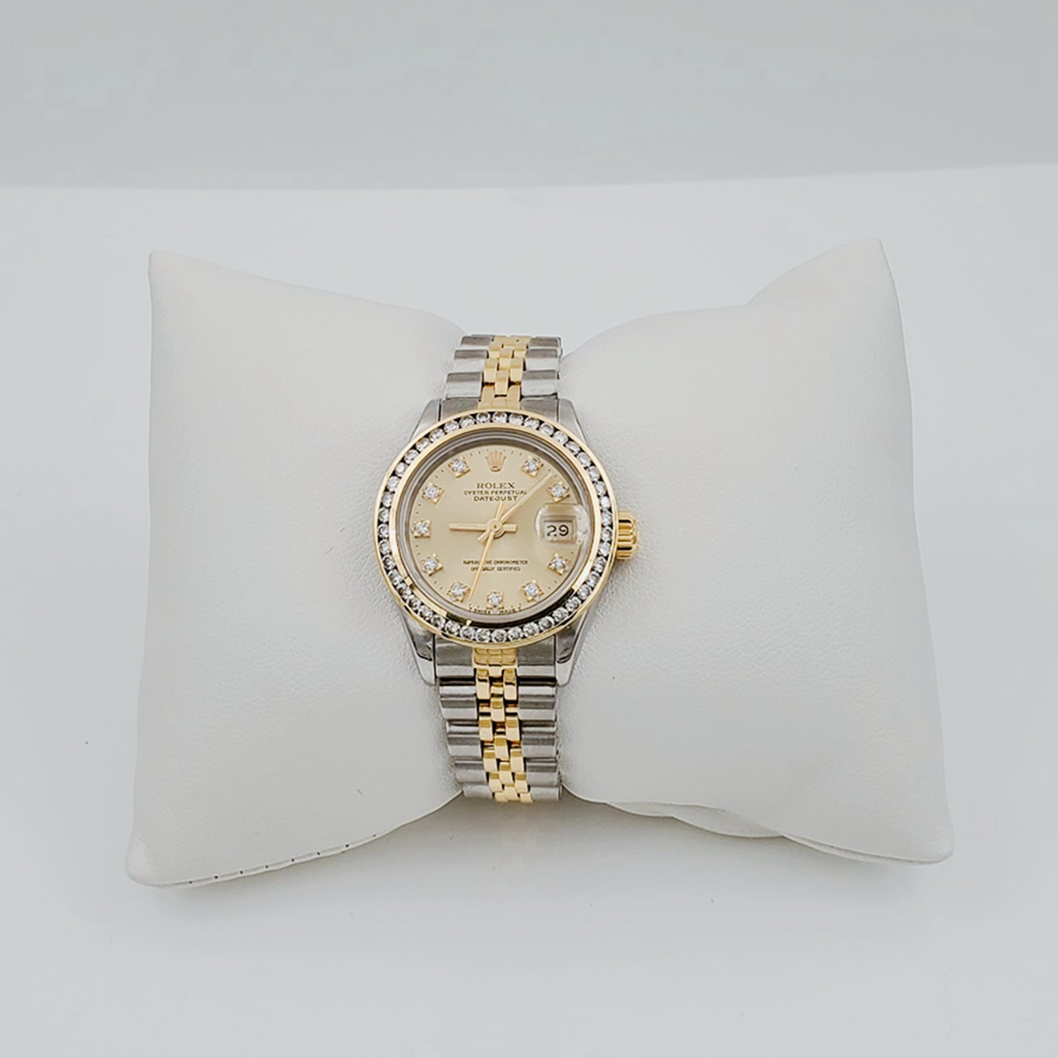 Ladies Rolex 26mm DateJust 18K Gold / Two Tone Stainless Steel Watch with Champagne Diamond Dial and Diamond Bezel. (Pre-Owned)