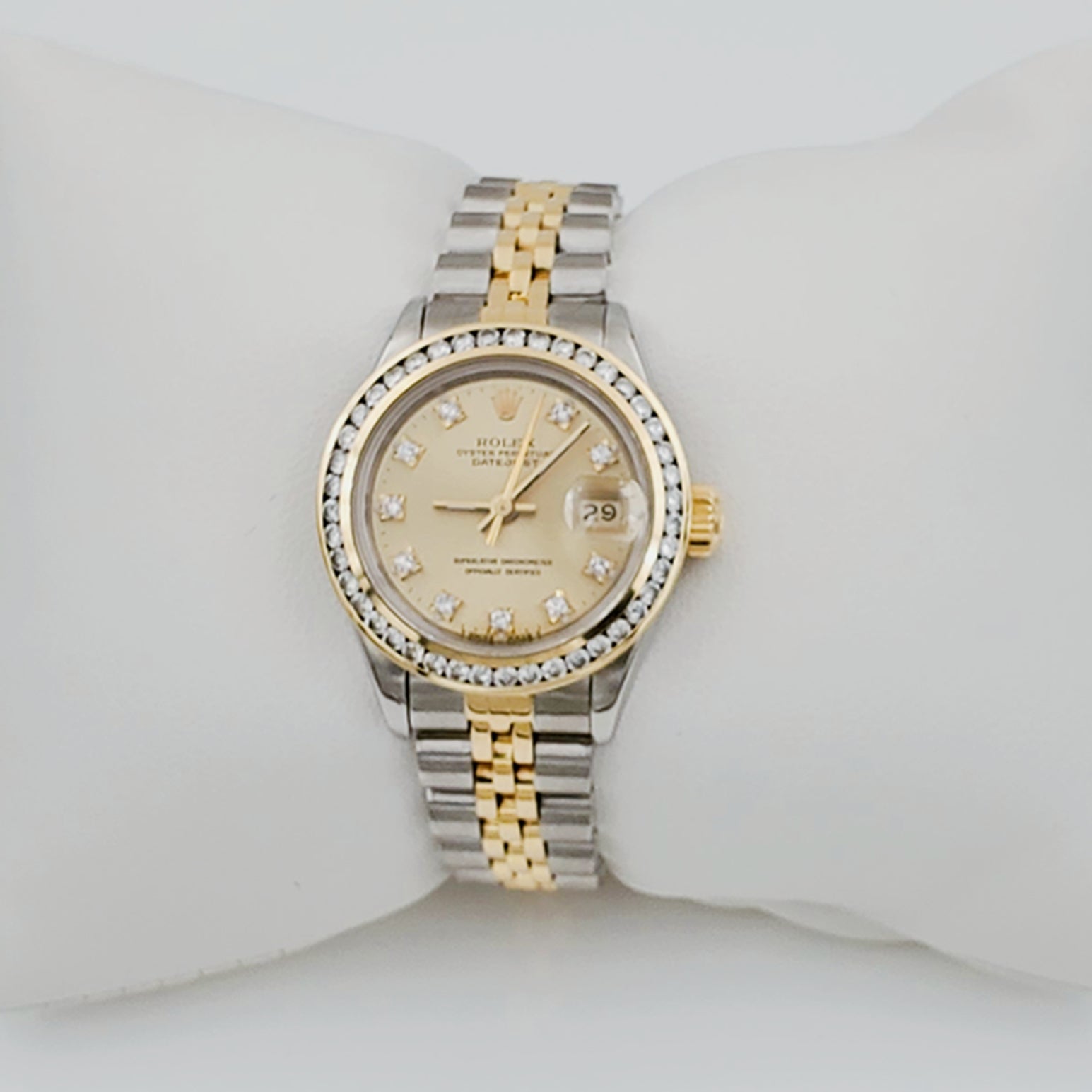 Ladies Rolex 26mm DateJust 18K Gold / Two Tone Stainless Steel Watch with Champagne Diamond Dial and Diamond Bezel. (Pre-Owned)