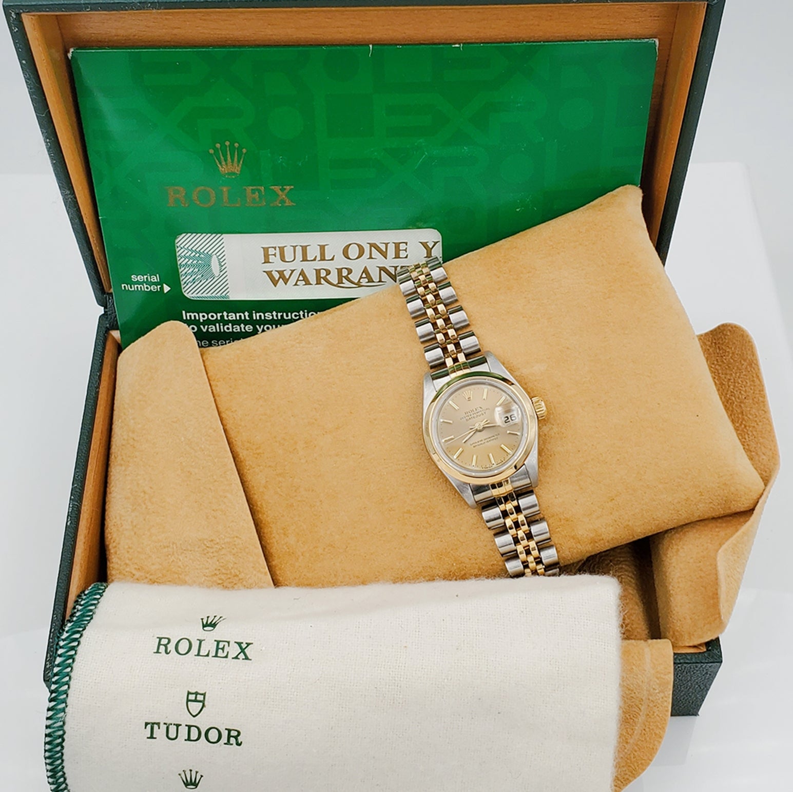 Ladies Rolex 26mm DateJust Two Tone 18K Gold Watch with Champagne Dial and Smooth Bezel. (Pre-Owned)