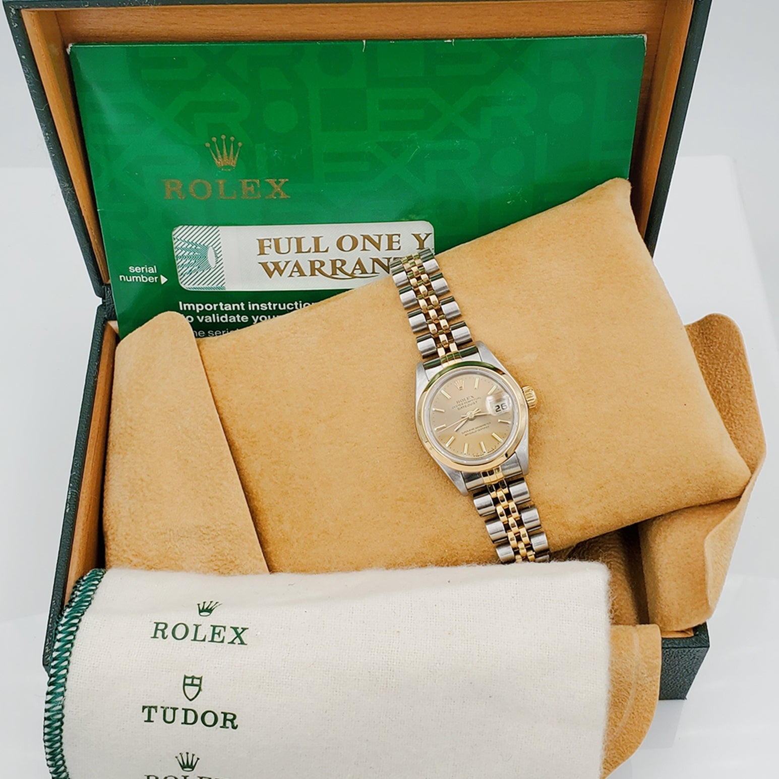 Ladies Rolex 26mm DateJust Two Tone 18K Gold Watch with Champagne Dial and Smooth Bezel. (Pre-Owned)