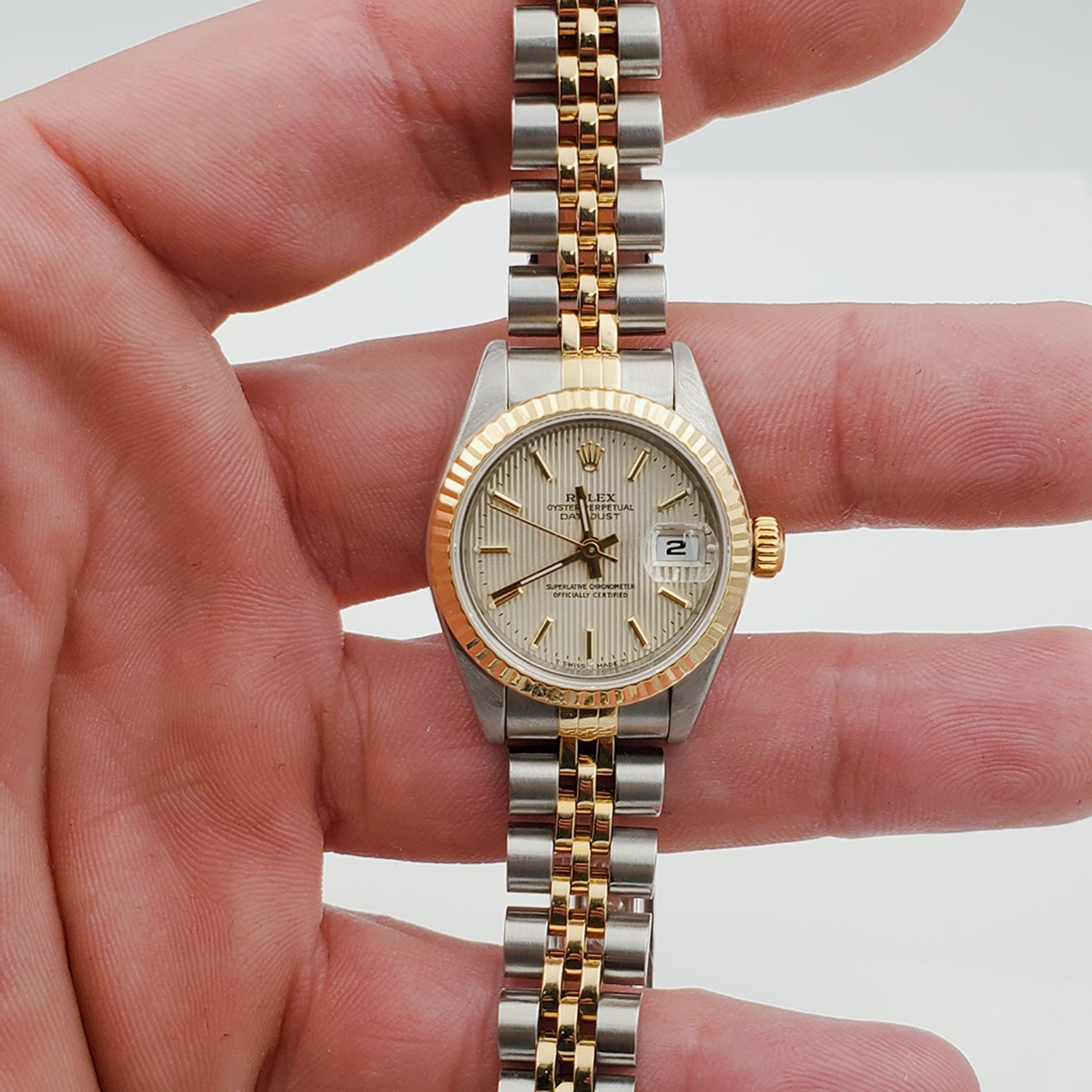 Ladies Rolex 26mm DateJust Two Tone 18K Yellow Gold / Stainless Steel Watch with Tapestry Dial and Fluted Bezel. (Pre-Owned)