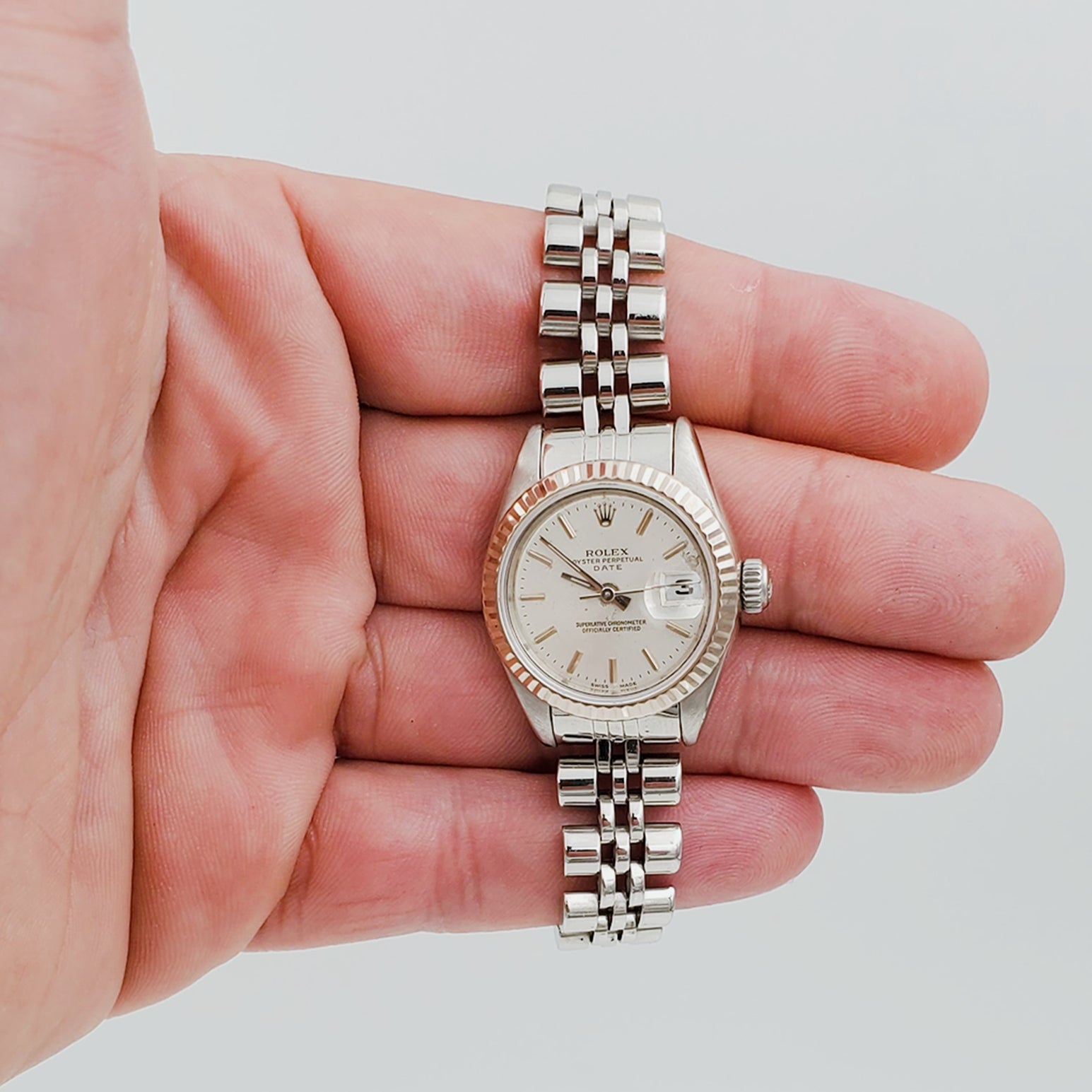 Ladies Rolex 26mm DateJust 18K White Gold / Stainless Steel Watch with Silver Dial and Fluted Bezel. (Pre-Owned)