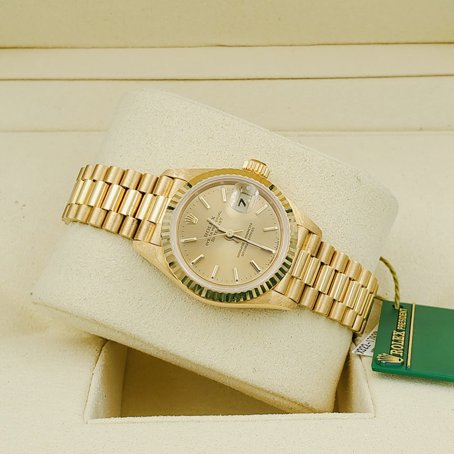 Ladies Rolex 26mm Presidential 18K Solid Yellow Gold Watch with Champagne Dial and Fluted Bezel. (NEW 69178)