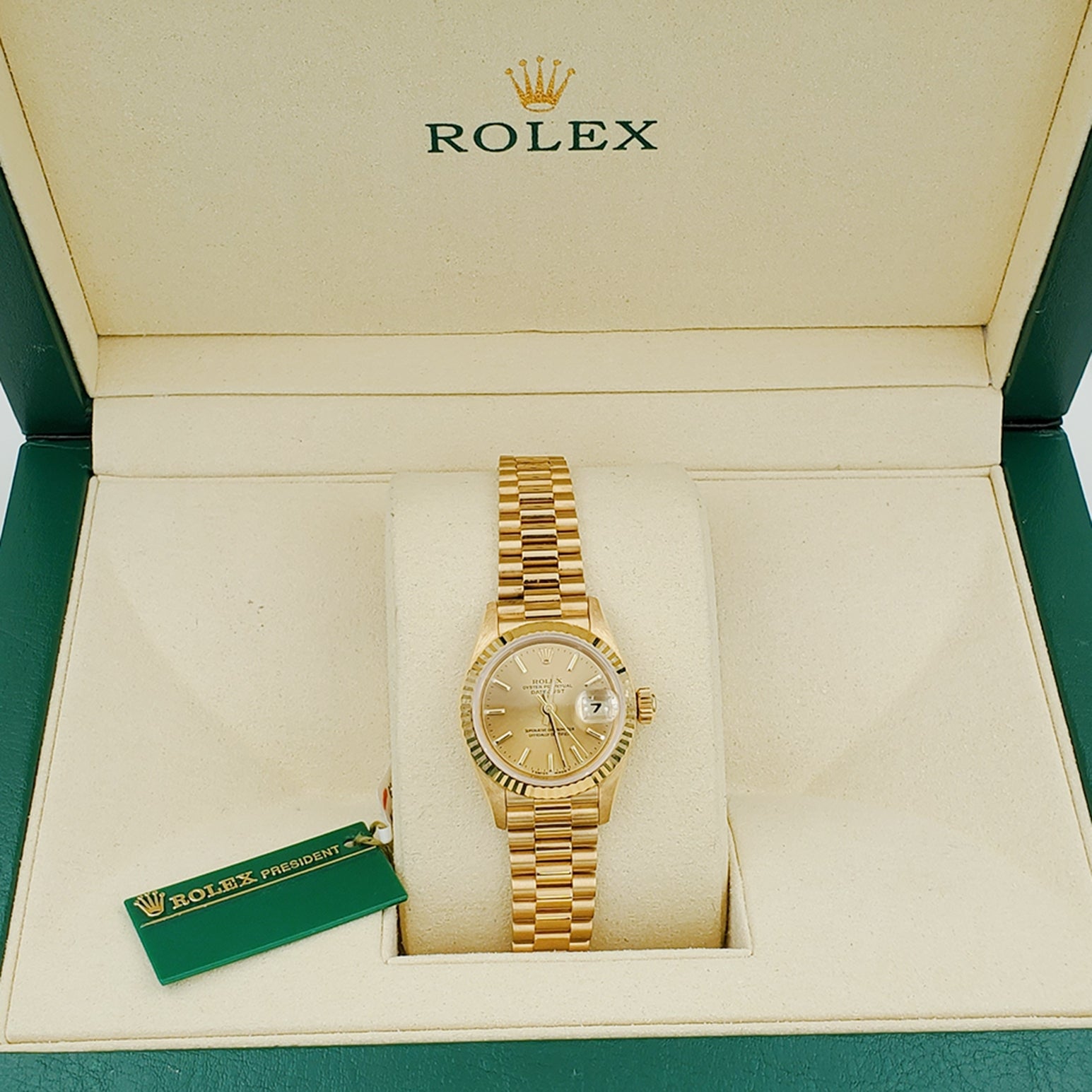 Ladies Rolex 26mm Presidential 18K Solid Yellow Gold Watch with Champagne Dial and Fluted Bezel. (NEW 69178)