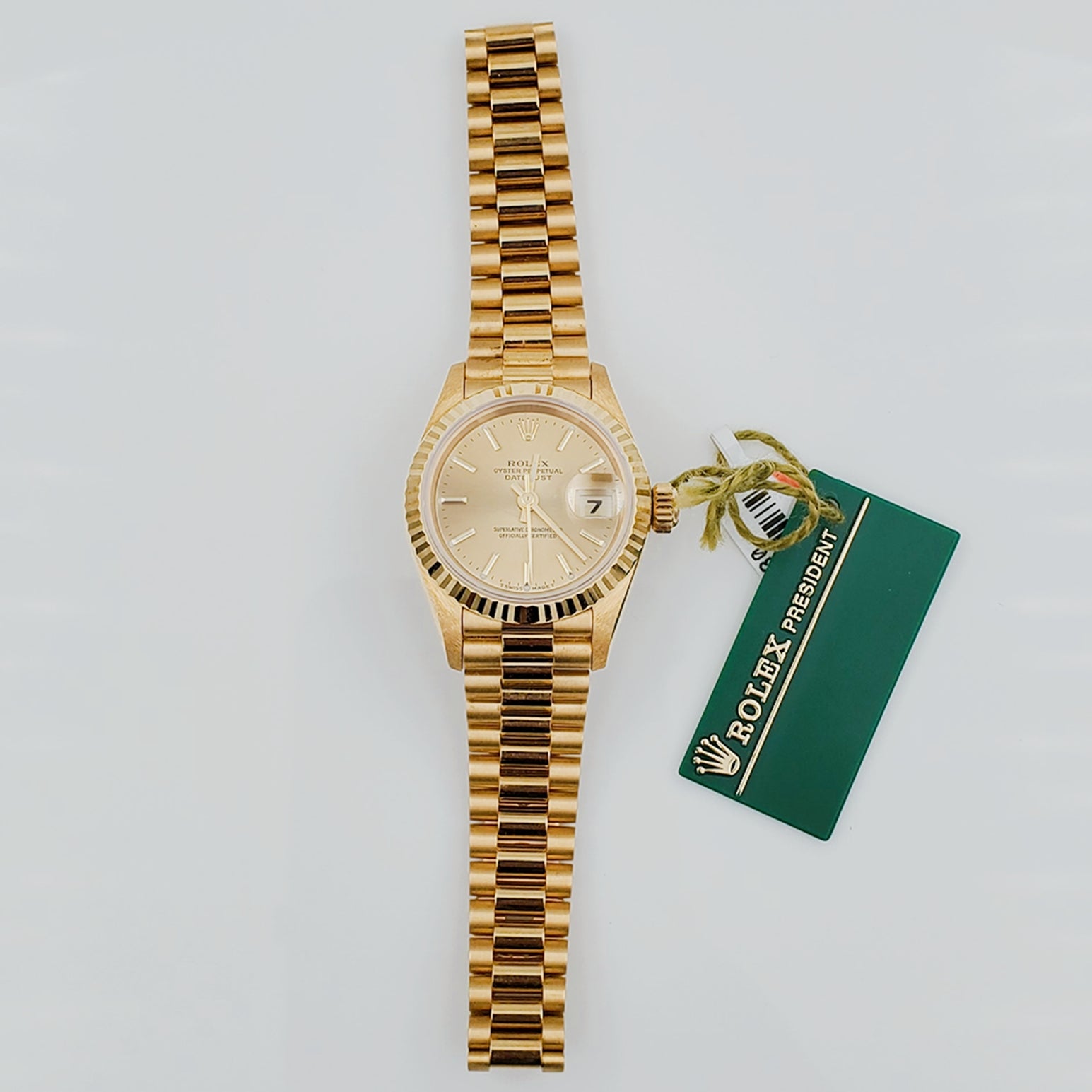 Ladies Rolex 26mm Presidential 18K Solid Yellow Gold Watch with Champagne Dial and Fluted Bezel. (NEW 69178)