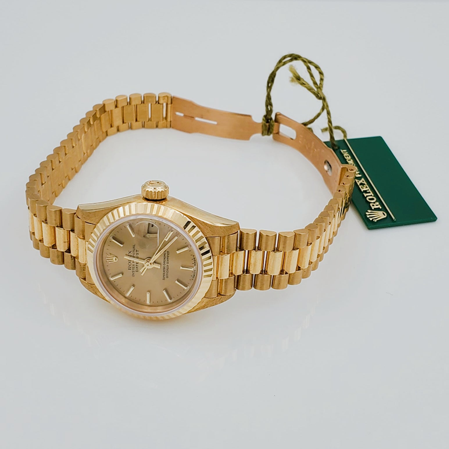 Ladies Rolex 26mm Presidential 18K Solid Yellow Gold Watch with Champagne Dial and Fluted Bezel. (NEW 69178)