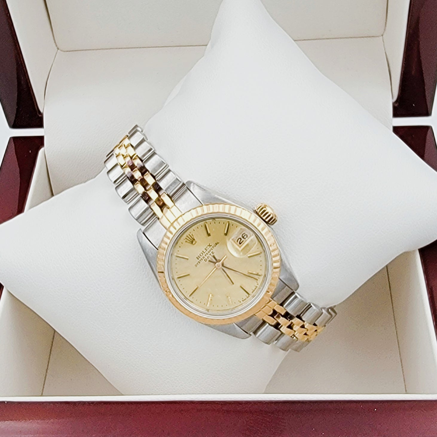 Ladies Rolex 26mm Date Two Tone 18K Yellow Gold / Stainless Steel Watch with Champagne Dial and Fluted Bezel. (Pre-Owned)