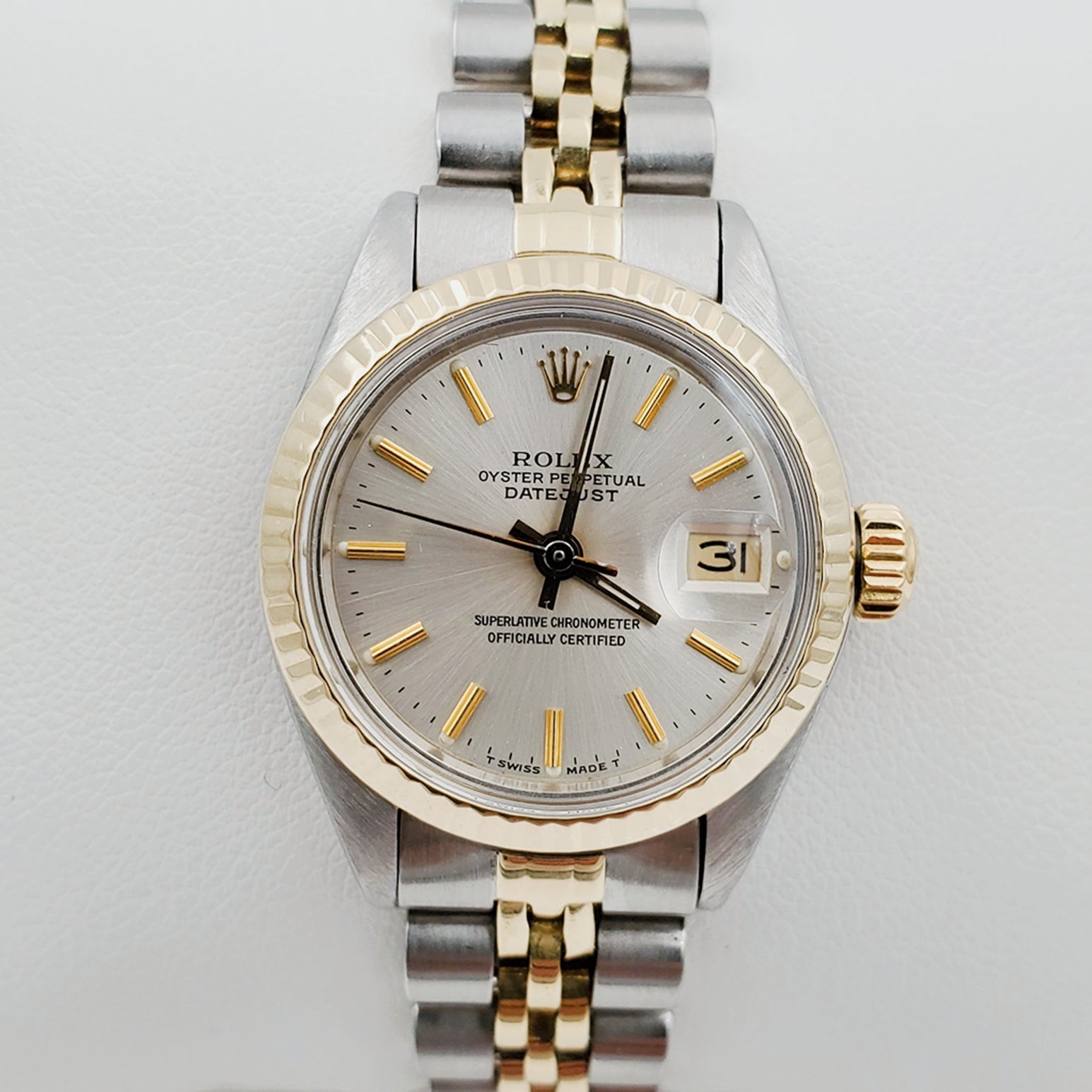 Ladies Rolex 26mm DateJust Two Tone 14K Yellow Gold / Stainless Steel Watch with Silver Dial and 14k Fluted Bezel. (Pre-Owned)