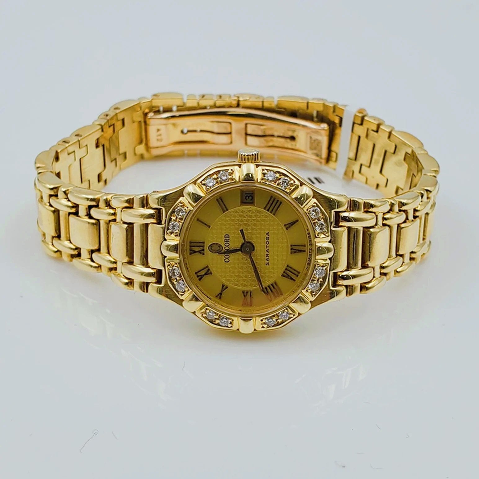 Ladies Concord Sarento 24mm Solid 18K Yellow Gold Band Watch with Roman Numeral Gold Dial and Diamond Bezel. (Pre-Owned)