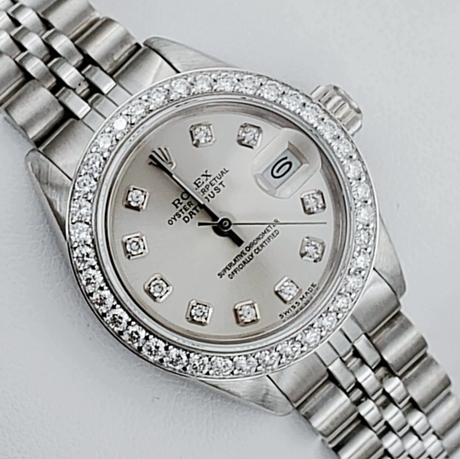 Ladies Rolex 26mm DateJust Stainless Steel Watch with Silver Diamond Dial and Diamond Bezel. (Pre-Owned 69174)