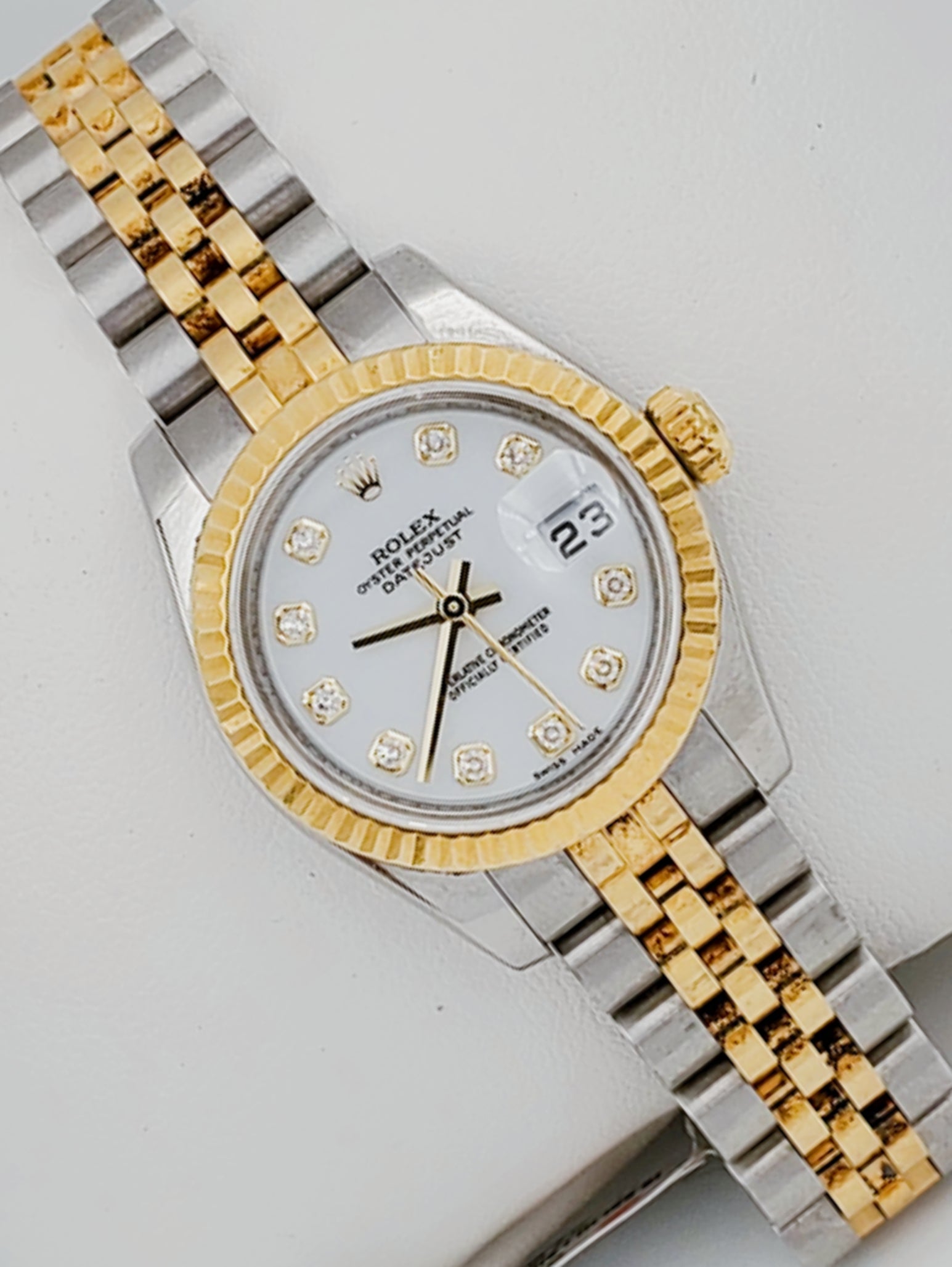 Ladies Rolex 26mm DateJust Two Tone Stainless Steel 18K Gold Watch with White Diamond Dial and Fluted Bezel. (Pre-Owned)