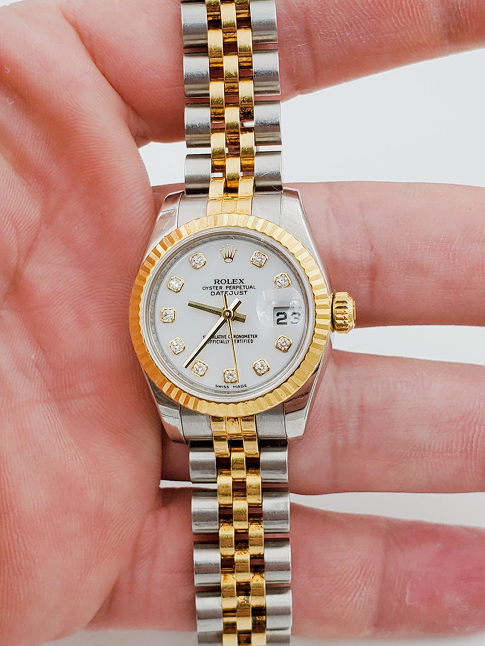 Ladies Rolex 26mm DateJust Two Tone Stainless Steel 18K Gold Watch with White Diamond Dial and Fluted Bezel. (Pre-Owned)