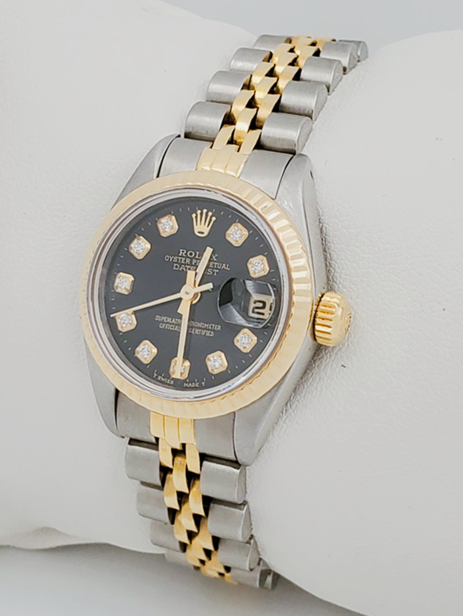 Ladies Rolex 26mm DateJust Two Tone 18K Gold / Stainless Steel Watch with Black Diamond Dial and Fluted Bezel. (Pre-Owned)