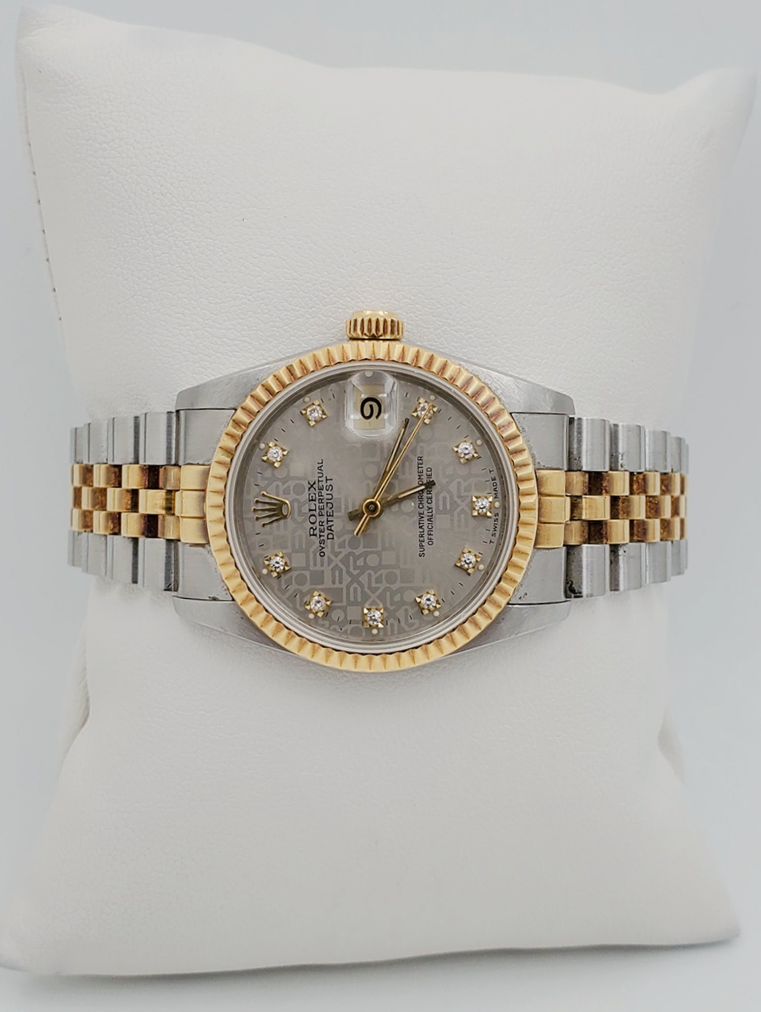 Ladies Rolex Midsize 31mm DateJust Two Tone 18K Yellow Gold / Stainless Steel Watch with Silver Diamond Dial and Fluted Bezel. (Pre-Owned 682735)