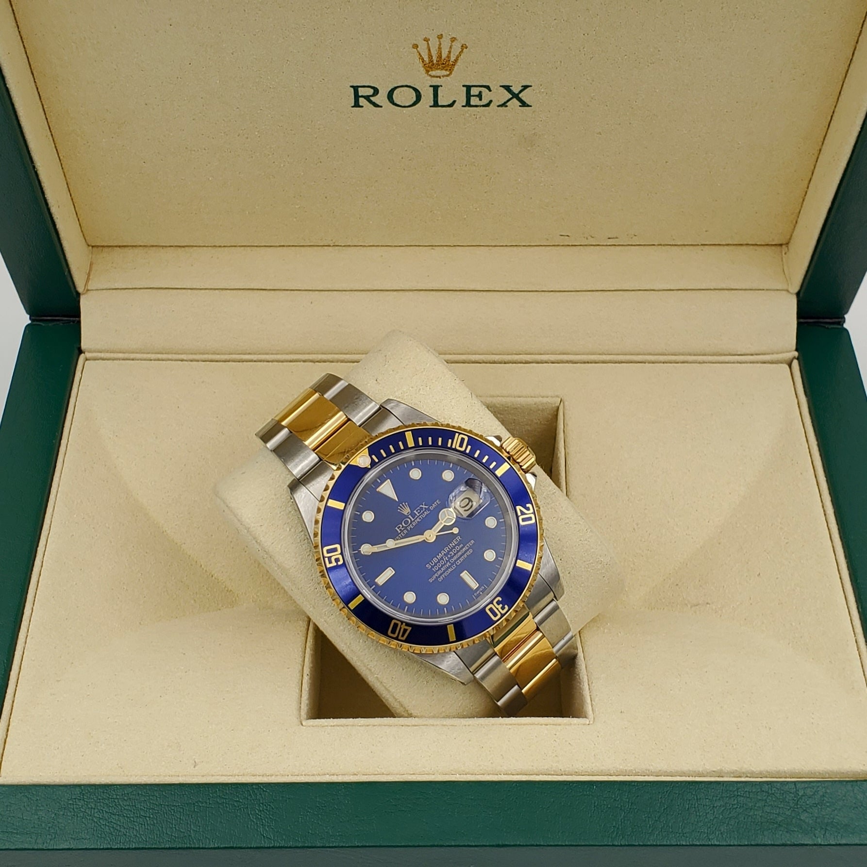 *1999 Men's Rolex 40mm Submariner Oyster Perpetual Two Tone 18K Yellow Gold / Stainless Steel Watch with Blue Dial and Blue Bezel. (Pre-Owned 16613)