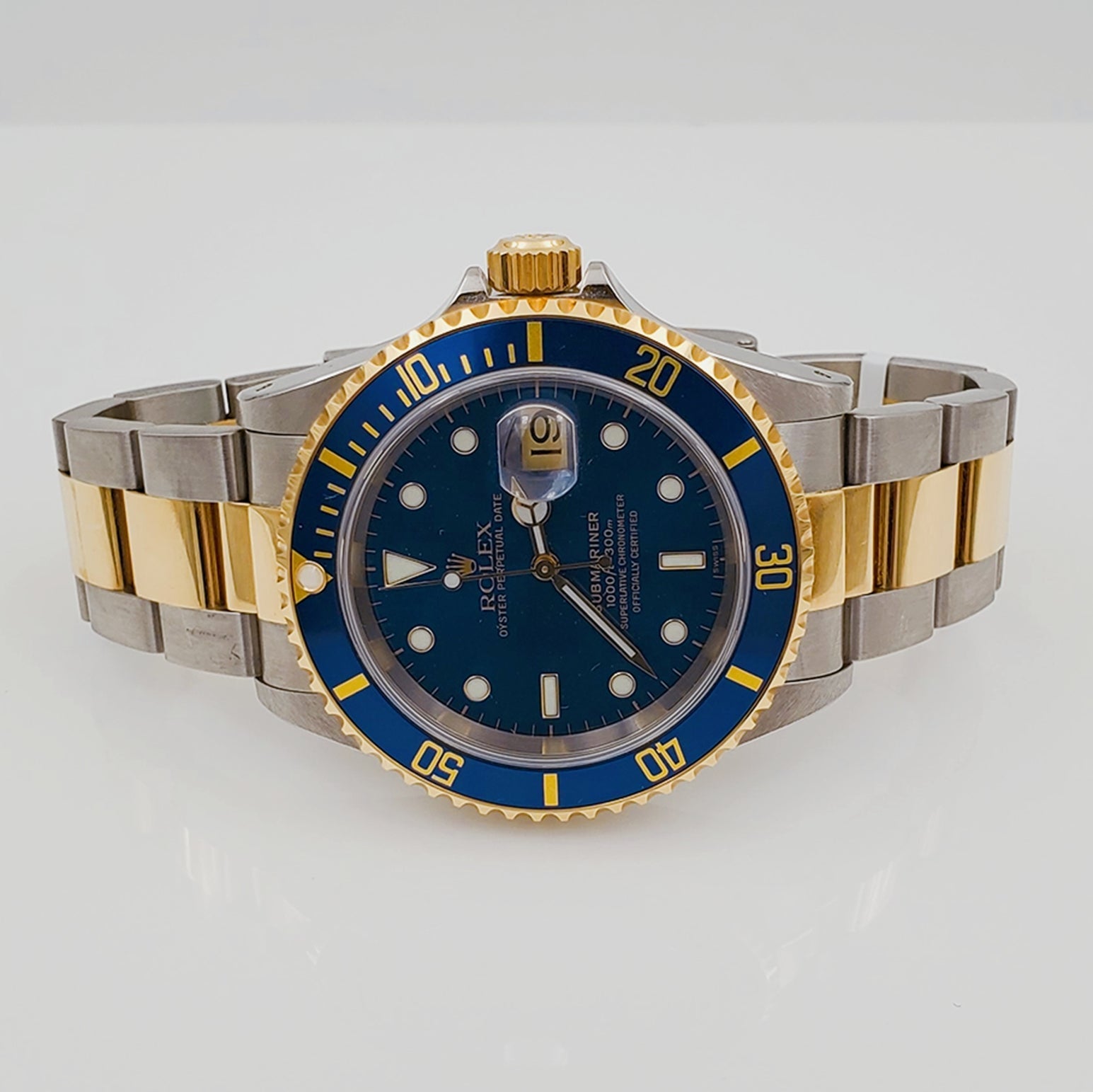 *1999 Men's Rolex 40mm Submariner Oyster Perpetual Two Tone 18K Yellow Gold / Stainless Steel Watch with Blue Dial and Blue Bezel. (Pre-Owned 16613)