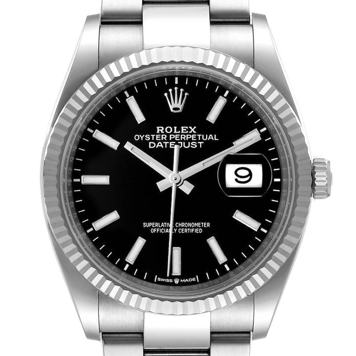 Ladies Midsize Rolex 31mm DateJust Stainless Steel Watch with Black Dial and Fluted Bezel. (Pre-Owned 17824C)