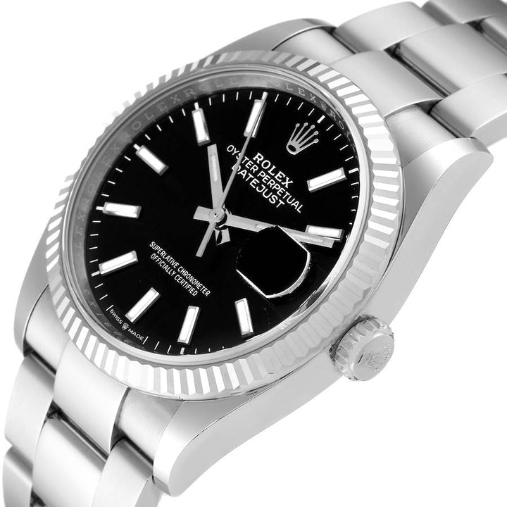 Ladies Midsize Rolex 31mm DateJust Stainless Steel Watch with Black Dial and Fluted Bezel. (Pre-Owned 17824C)