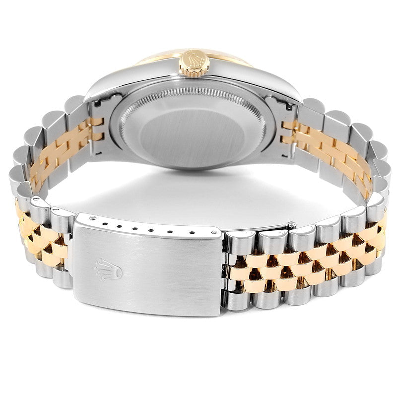 Ladies Rolex 26mm DateJust Two Tone 18K Yellow Gold / Stainless Steel Watch with Champagne Diamond Dial and Fluted Bezel. (Pre-Owned 69173)