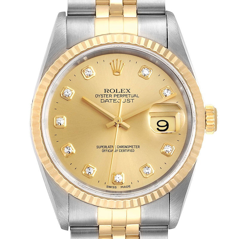 Ladies Rolex 26mm DateJust Two Tone 18K Yellow Gold / Stainless Steel Watch with Champagne Diamond Dial and Fluted Bezel. (Pre-Owned 69173)