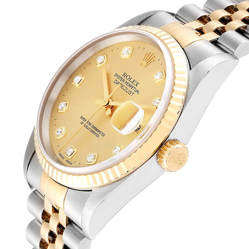 Ladies Rolex 26mm DateJust Two Tone 18K Yellow Gold / Stainless Steel Watch with Champagne Diamond Dial and Fluted Bezel. (Pre-Owned 69173)
