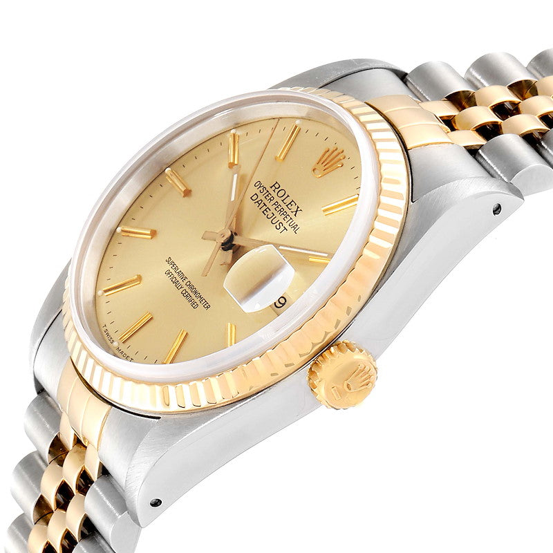 Ladies Rolex 26mm DateJust Two Tone 18K Gold Watch with Champagne Dial and 18k Fluted Bezel. (Pre-Owned)