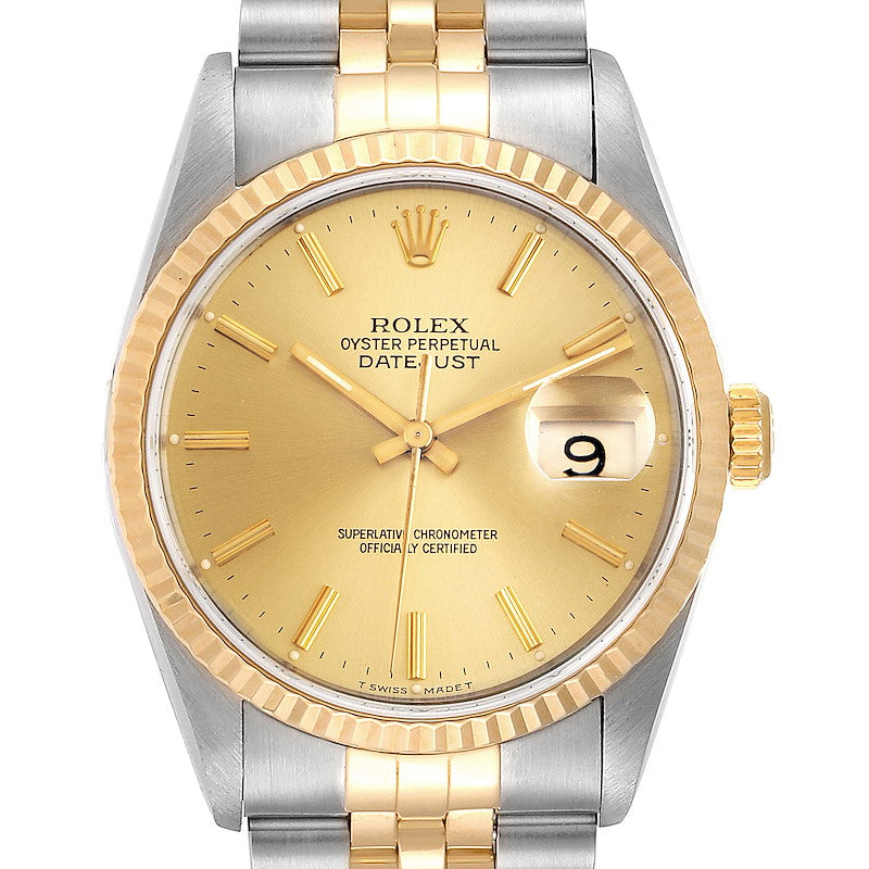 Ladies Rolex 26mm DateJust Two Tone 18K Yellow Gold / Stainless Steel Watch with Champagne Dial and Fluted Bezel. (Pre-Owned)