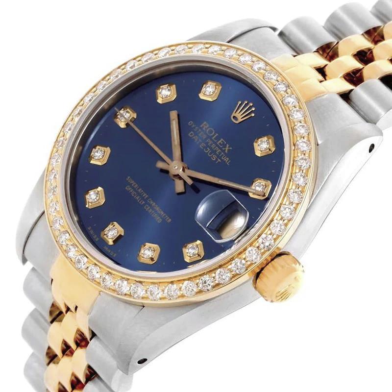 Ladies Rolex 26mm DateJust Two Tone 18K Yellow Gold Watch with Blue Diamond Dial and Custom Diamond Bezel. (Pre-Owned)