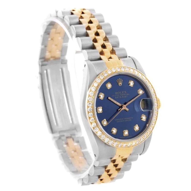 Ladies Rolex 26mm DateJust Two Tone 18K Yellow Gold Watch with Blue Diamond Dial and Custom Diamond Bezel. (Pre-Owned)